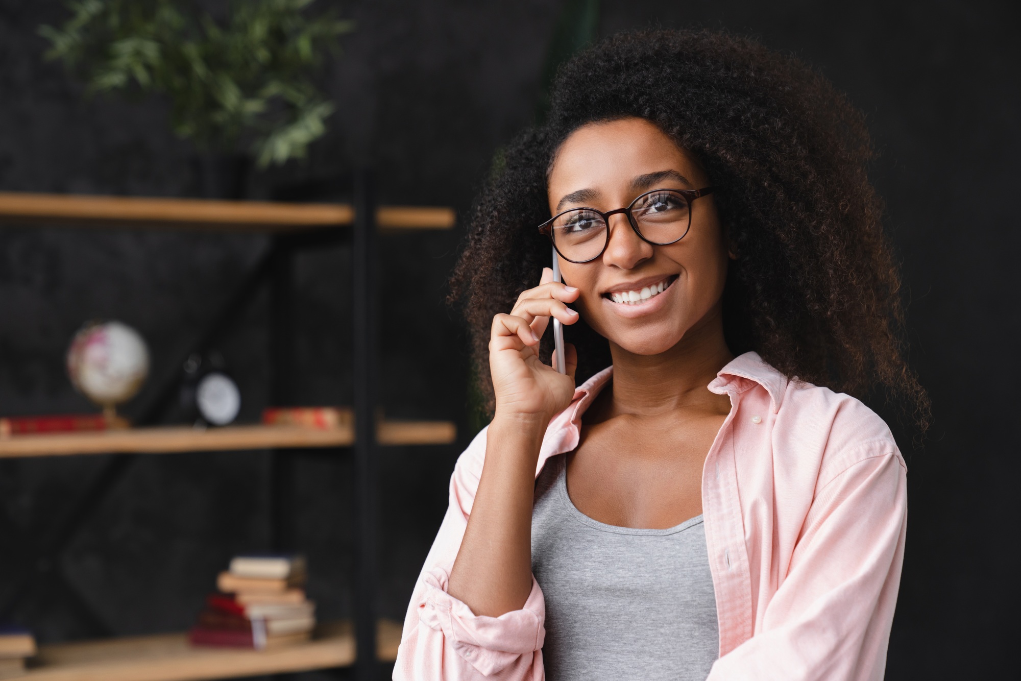 Student talking on smart phone cellphone with good connection at home
